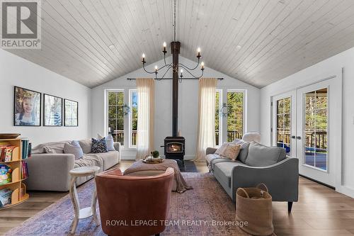 WETT certified wood stove - 36 Hillcrest Avenue, Killaloe, Hagarty And Richards, ON - Indoor Photo Showing Living Room With Fireplace