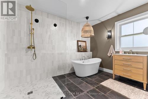 walk in tile shower and elegant tub in ensuite bat - 36 Hillcrest Avenue, Killaloe, Hagarty And Richards, ON - Indoor Photo Showing Bathroom