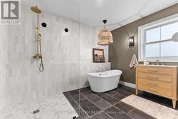 walk in tile shower and elegant tub in ensuite bat - 