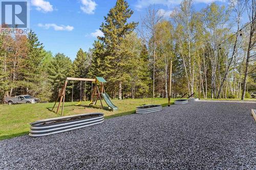 rear of home - crushed stone and raised bed garden - 36 Hillcrest Avenue, Killaloe, Hagarty And Richards, ON - Outdoor