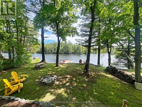 Family-friendly waterfront; firepit - 13 Peninsula Shores Road E, Mcdougall, ON - Outdoor With Body Of Water