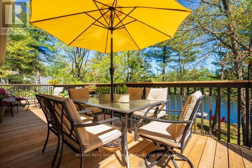 Outdoor dining with lake views - 13 Peninsula Shores Road E, Mcdougall, ON - Outdoor With Deck Patio Veranda With Exterior