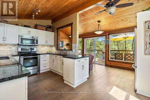 Walkout to lakeside deck - 13 Peninsula Shores Road E, Mcdougall, ON - Indoor Photo Showing Kitchen With Upgraded Kitchen