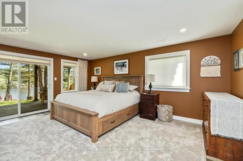 Principal bedroom w walkout - 13 Peninsula Shores Road E, Mcdougall, ON - Indoor Photo Showing Bedroom