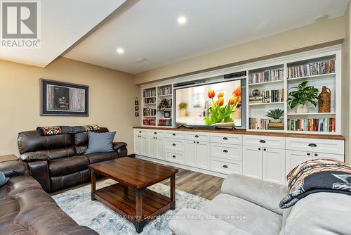 Family room w built in cabinetry - 13 Peninsula Shores Road E, Mcdougall, ON - Indoor Photo Showing Living Room