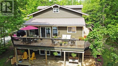 Wrap around decking - 13 Peninsula Shores Road E, Mcdougall, ON - Outdoor With Deck Patio Veranda