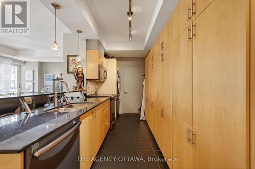 Sleek kitchen with storage wall - 905 - 85 Bronson Avenue, Ottawa, ON - Indoor Photo Showing Kitchen With Double Sink