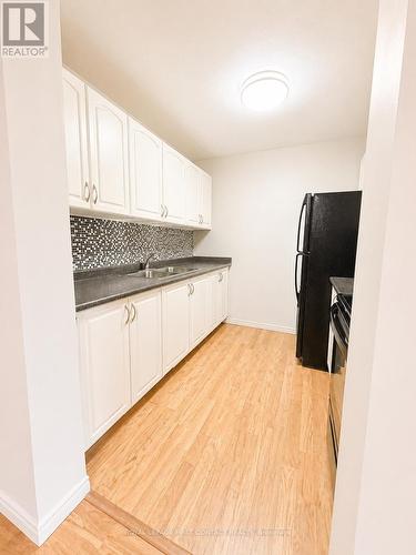 B7 - 179 Edgehill Drive, Barrie, ON - Indoor Photo Showing Kitchen With Double Sink