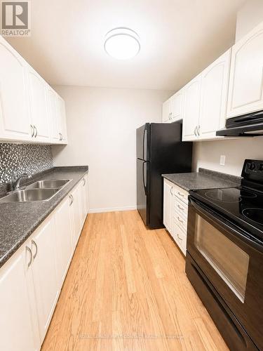 B7 - 179 Edgehill Drive, Barrie, ON - Indoor Photo Showing Kitchen With Double Sink