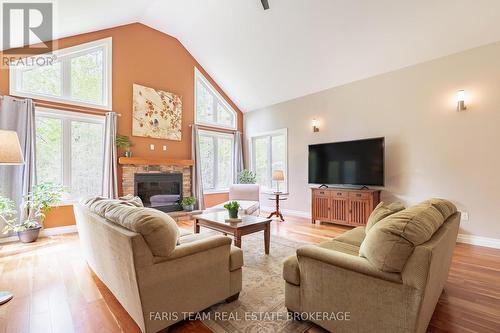 470 Baseline Road S, Tiny, ON - Indoor Photo Showing Living Room With Fireplace