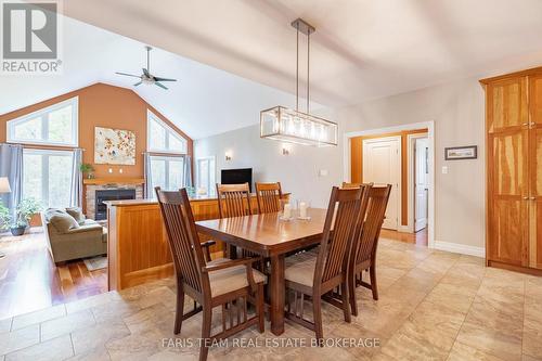 470 Baseline Road S, Tiny, ON - Indoor Photo Showing Dining Room With Fireplace