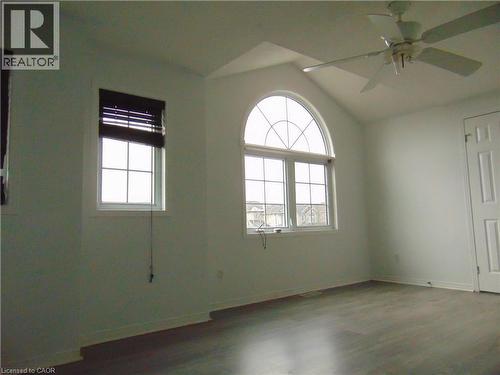 Vaulted ceiling featuring a large arched window and a ceiling fan - 90 Bridlewreath Street Unit# Upper Unit, Kitchener, ON - Indoor Photo Showing Other Room