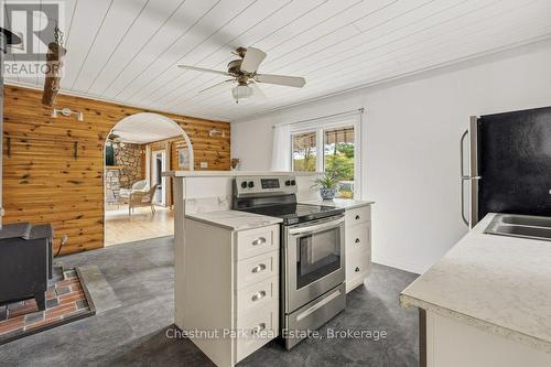 Kitchen with Patio Doors onto Deck - 1026 Carlson Place, Bracebridge (Draper), ON - Indoor Photo Showing Kitchen With Double Sink