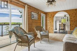 Living room with sliding patio door onto deck - 