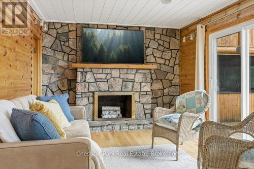 Wood Fireplace in Livingroom - 1026 Carlson Place, Bracebridge (Draper), ON - Indoor Photo Showing Living Room With Fireplace