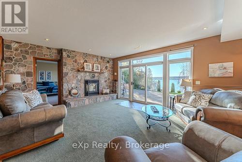 Lower Level Walkout - 502411 Grey Road 1 Road, Georgian Bluffs, ON - Indoor Photo Showing Living Room With Fireplace