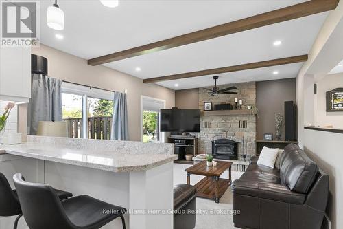 8 Stonefield Drive, Woolwich, ON - Indoor Photo Showing Living Room With Fireplace