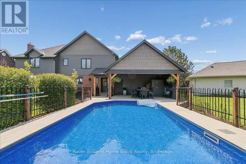 8 Stonefield Drive, Woolwich, ON - Outdoor With In Ground Pool With Deck Patio Veranda