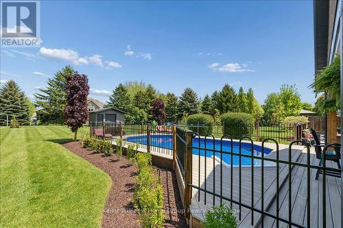8 Stonefield Drive, Woolwich, ON - Outdoor With In Ground Pool