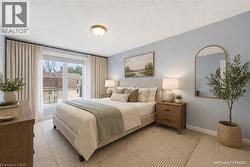 Expansive window with natural light and neutral-toned drapery - 