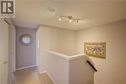 Upper landing area featuring neutral carpet flooring and light-toned wall paint - 53 Prosperity Drive, Kitchener, ON - Indoor Photo Showing Other Room