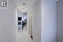 Hallway featuring light wood-finish flooring, white walls, and track lighting - 53 Prosperity Drive, Kitchener, ON  - Indoor Photo Showing Other Room 