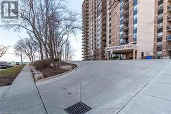 Modern high-rise building featuring a prominent ""Shopeliner 500"" entrance sign - 