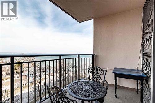 Outdoor balcony featuring a metal railing and a serene water backdrop - 500 Green Road Unit# 901, Stoney Creek, ON - Outdoor With Balcony With Exterior