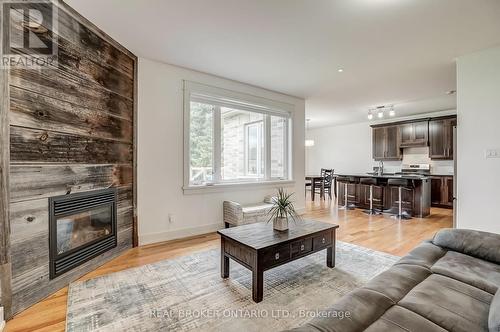 6237 Perth Street, Ottawa, ON - Indoor Photo Showing Living Room With Fireplace