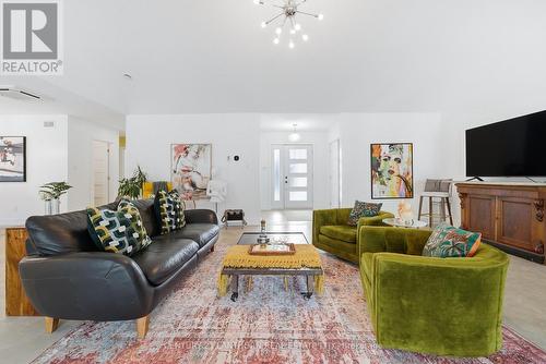 vaulted ceiling and dual generous entryways - 2654 County Road 5, Prince Edward County (Sophiasburg Ward), ON - Indoor Photo Showing Living Room