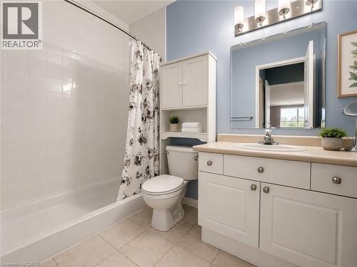 Bathroom featuring a spacious tub and shower combination with white subway tile surround - 255 Keats Way Unit# 606, Waterloo, ON - Indoor Photo Showing Bathroom