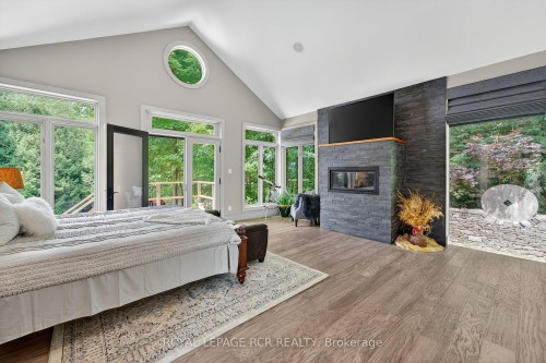 18 Mount Haven Crescent, East Luther Grand Valley, ON - Indoor Photo Showing Bedroom With Fireplace
