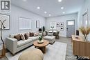 Open-concept living space featuring light gray walls, recessed lighting, and wood-finish flooring - 78 Hillyard Street, Hamilton, ON  - Indoor Photo Showing Living Room 