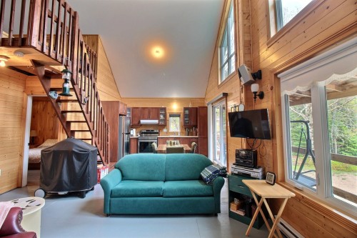 Vue d'ensemble - 962 Route 138, Saint-Siméon, QC - Indoor Photo Showing Living Room With Fireplace