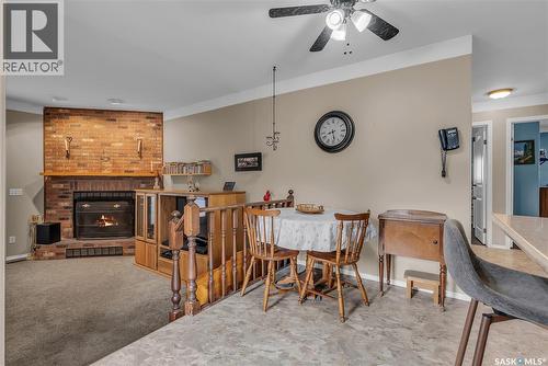 231 Benesh Crescent, Saskatoon, SK - Indoor Photo Showing Dining Room With Fireplace