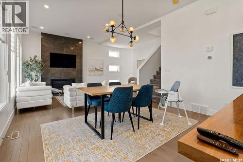 4238 Green Olive Way E, Regina, SK - Indoor Photo Showing Dining Room With Fireplace