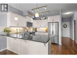 White Kitchen with Granite Countertops - 