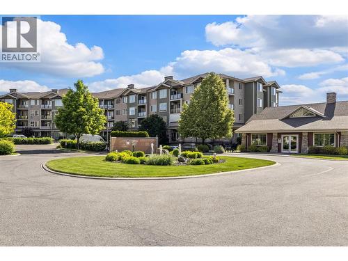 Beautifully Landscaped, Fountain and Clubhouse - 3735 Casorso Road Unit# 410, Kelowna, BC - Outdoor With Facade