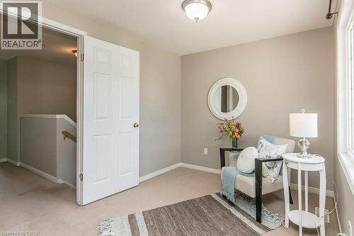 Carpeted room with neutral wall tones and a single window - 71 Foxglove Crescent, Kitchener, ON - Indoor Photo Showing Other Room