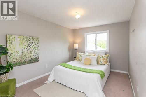 Neutral-toned walls complement the light-colored carpet flooring - 71 Foxglove Crescent, Kitchener, ON - Indoor Photo Showing Bedroom