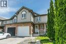 Two-story townhome featuring a brick and siding exterior with a pitched roof - 71 Foxglove Crescent, Kitchener, ON  - Outdoor 