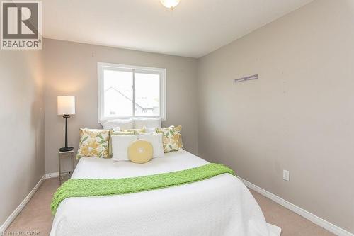Neutral-toned walls complement the light brown carpeting - 71 Foxglove Crescent, Kitchener, ON - Indoor Photo Showing Bedroom