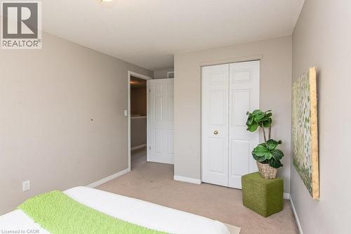 Neutral tone walls with light-colored carpeting - 71 Foxglove Crescent, Kitchener, ON - Indoor Photo Showing Bedroom