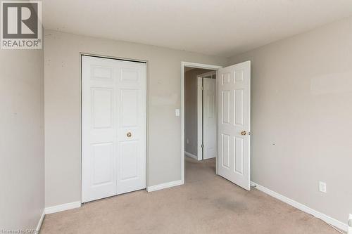 Room featuring neutral wall tones and light-colored carpeting - 71 Foxglove Crescent, Kitchener, ON - Indoor