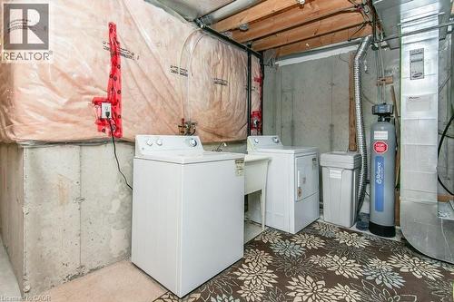 Dedicated utility area featuring a washer, dryer, and utility sink - 71 Foxglove Crescent, Kitchener, ON - Indoor Photo Showing Laundry Room