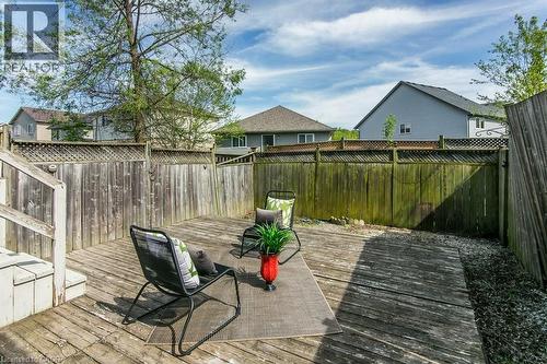 Expansive wood deck with stairs, surrounded by a wood privacy fence featuring lattice detailing - 71 Foxglove Crescent, Kitchener, ON - Outdoor With Deck Patio Veranda