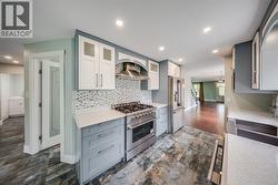 Beautifully updated kitchen with 6 burner range and a full walk-in pantry - 