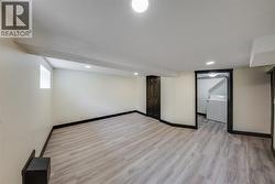 In-law Suite primary bedroom with walk-in closet and laundry - 