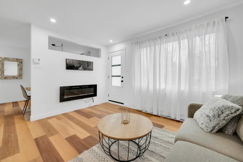 Salon - 175 Rue L'Allier, Laval (Sainte-Rose), QC - Indoor Photo Showing Living Room With Fireplace