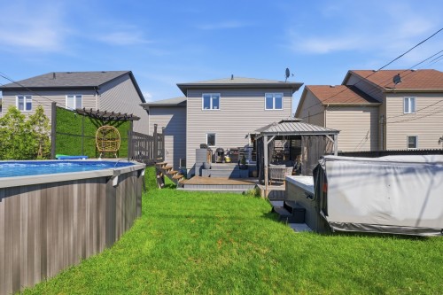 Cour - 267 Rue Capes, Saint-Constant, QC - Outdoor With Above Ground Pool With Exterior
